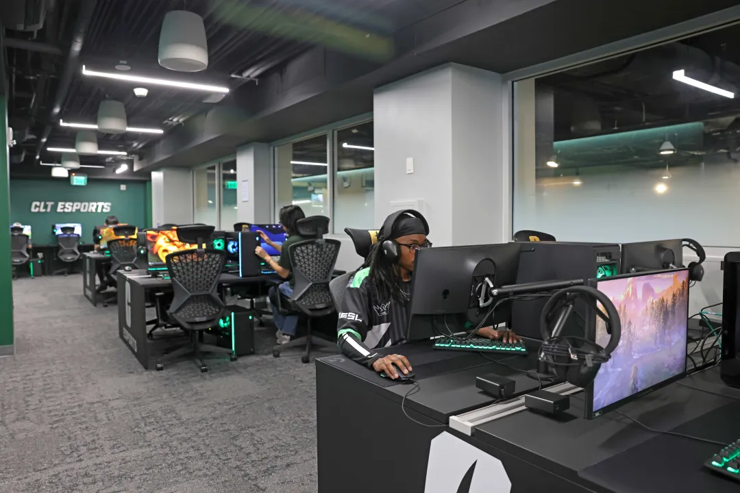 Students sitting at various desks in the new Charlotte Esports space