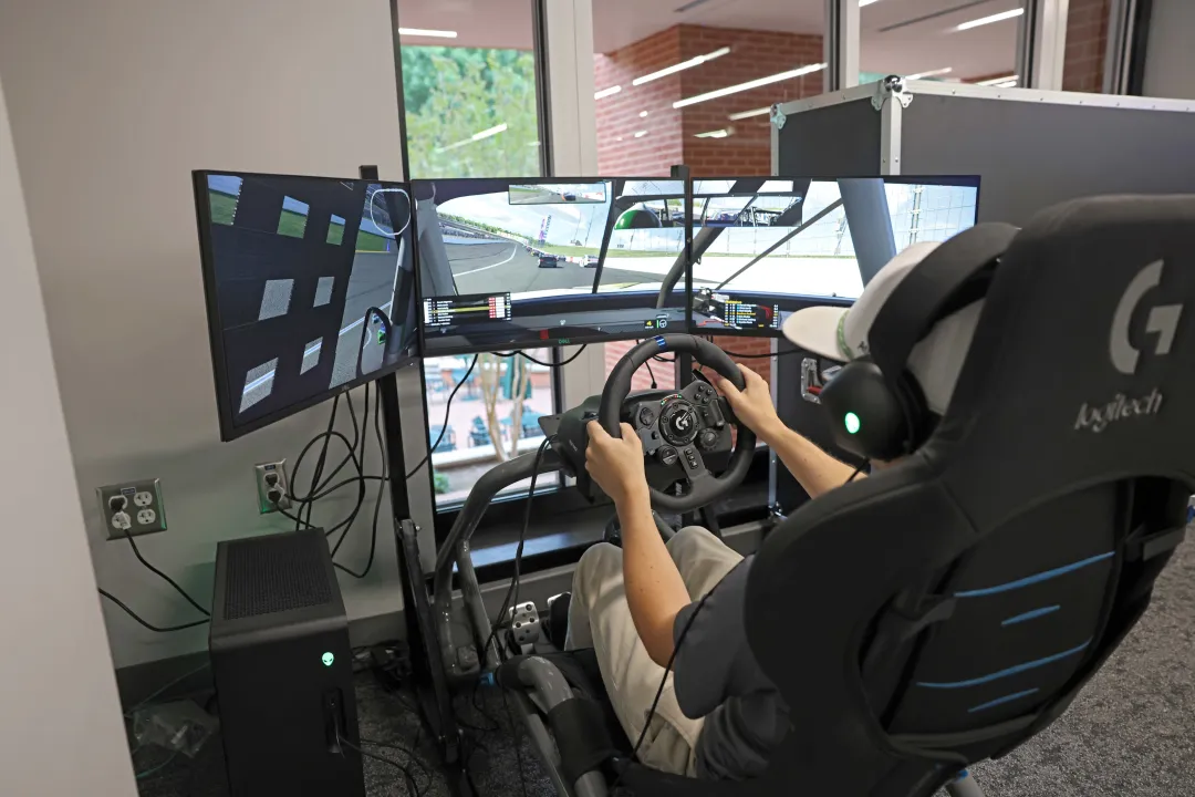 A student using the racing simulator in the new Charlotte Esports space